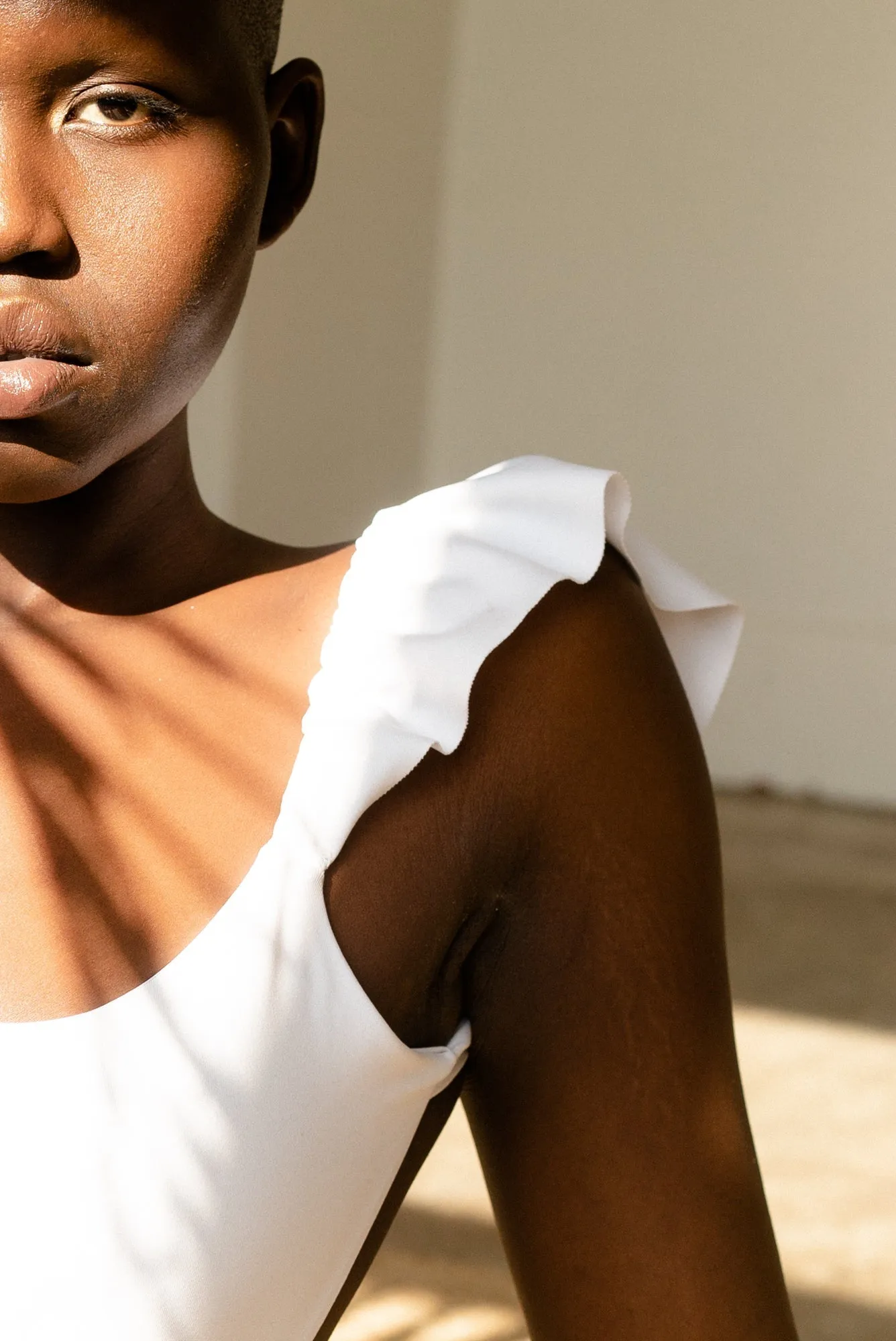 The Ruffle Shoulder One Piece - Flat White